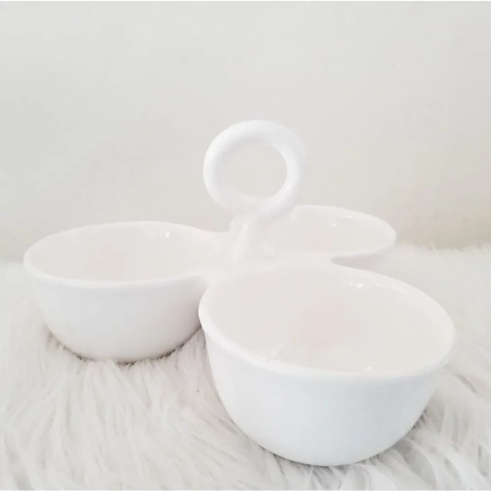 Condiment tray separated dishes.